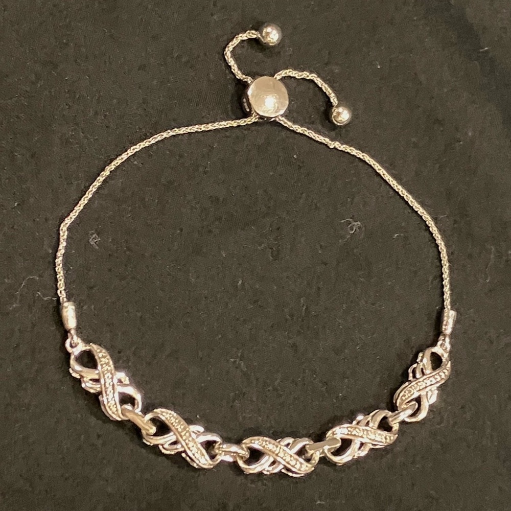 Infinity bracelet, sterling silver, diamonds w/ bolo clasp, adjustable to 9.5"